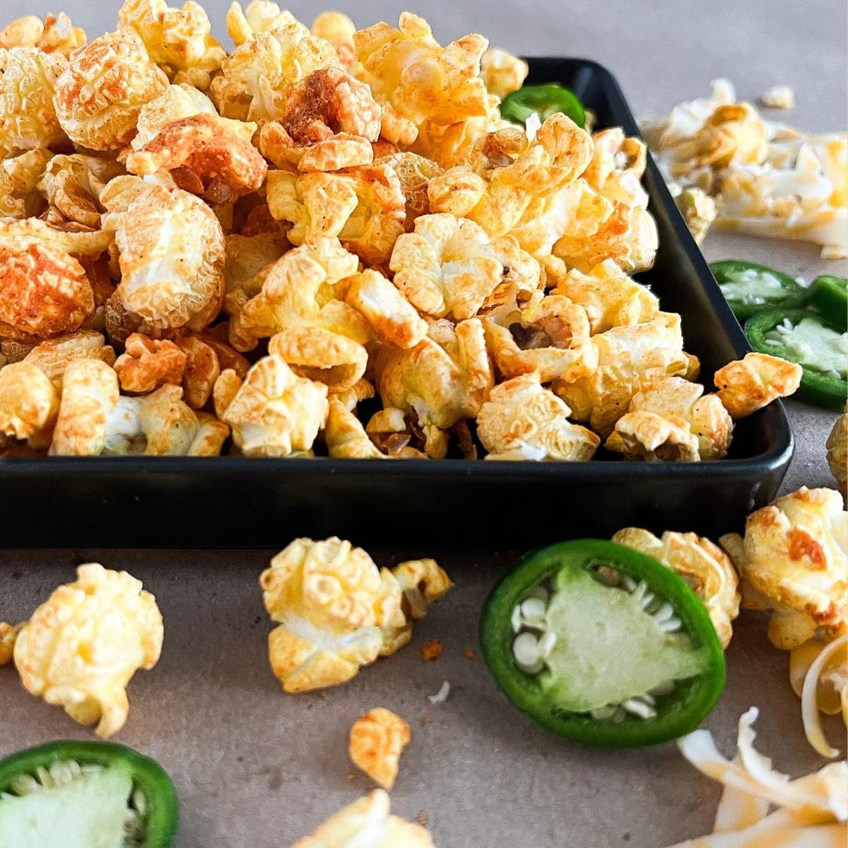 Cheesy popcorn with fresh jalapeño